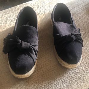 Tom’s canvas slip ons
